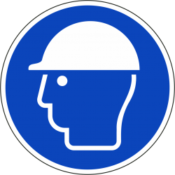 Een rond blauw ISO 7010 bord, met daarop een witte afbeelding van een hoofd met een veiligheidshelm.